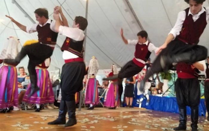 People at Greek Festival dancing