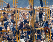 People climbing on scaffolding at Woodstock