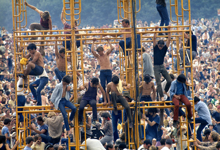 People climbing on scaffolding at Woodstock