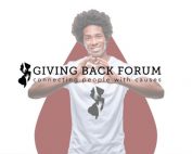 Man with hands in shape of a heart; Giving Back Forum