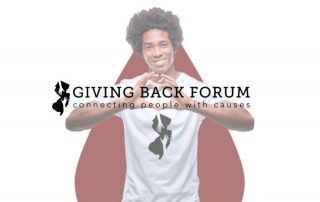 Man with hands in shape of a heart; Giving Back Forum