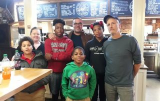 Jon Stewart with members of Male Mentorship Program