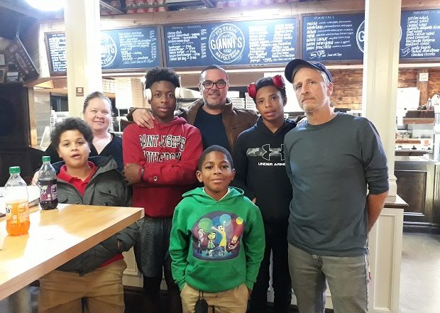 Jon Stewart with members of Male Mentorship Program