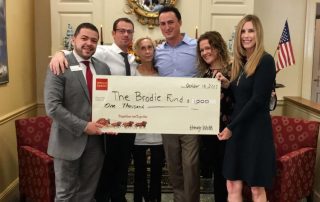 The Rumson Branch of Wells Fargo present a check to The Brodie Fund