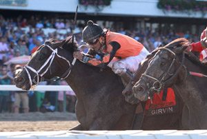 Jockey riding a brown horse