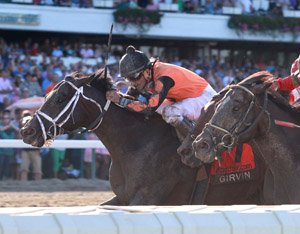 Jockey riding a brown horse