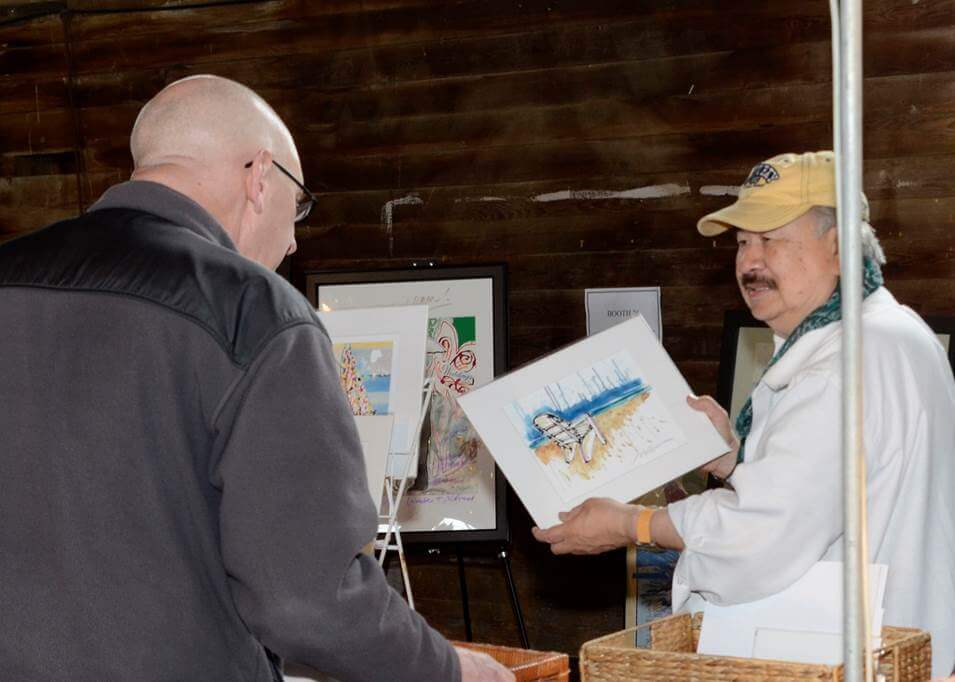 Man holding painting