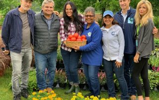 Jon Stewart with wife, family, volunteers for Farm Foundation