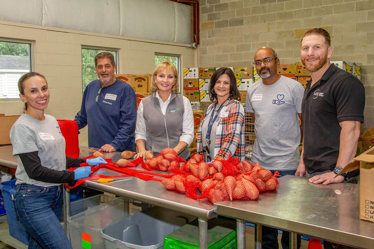 Kim Guadagno with Fulfill employees