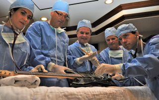 Doctors operating on guitar in emergency room