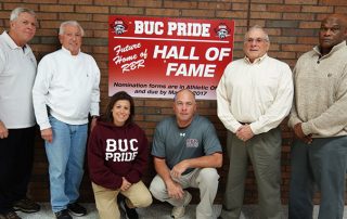 Coaches and former coaches in front of RBR Hall of Fame