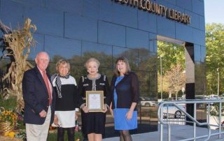 Lillian Burry being presented a Certificate of Honor from the The Monmouth County Library Commission