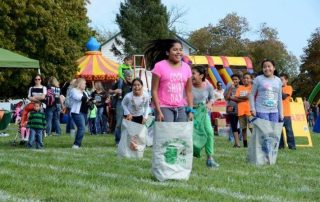 Children sack-racing at Thompson Day