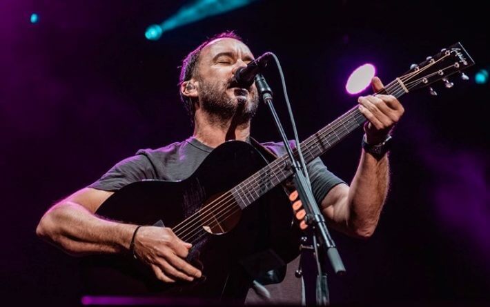 Dave Matthews onstage playing guitar