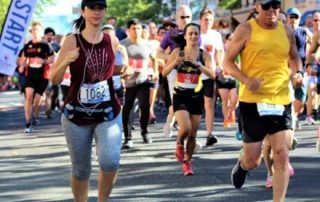 Group of people running in Red Bank Classic