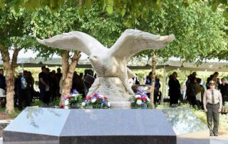 Bald eagle statue covered in flowers for 9/11 memorial