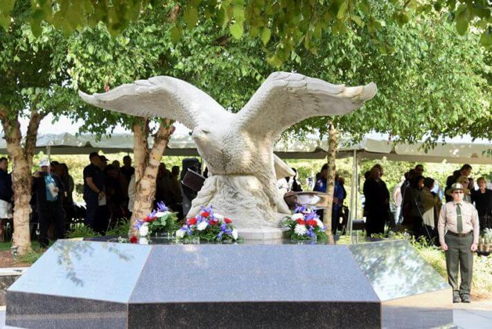 Bald eagle statue covered in flowers for 9/11 memorial