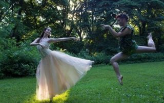 Ballet dancers dancing in the woods