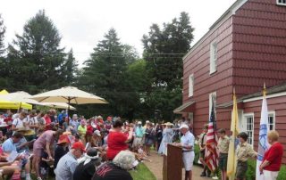 Crowd outside of Allen House celebrating July 4th