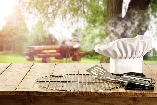 Photo of grilling equipment and chef hat