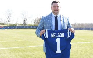 Nelson posing with his Colts jersey