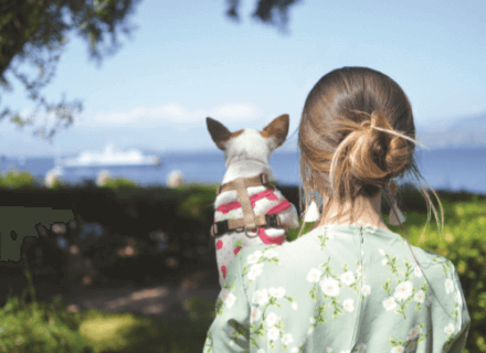 Woman holding her dog