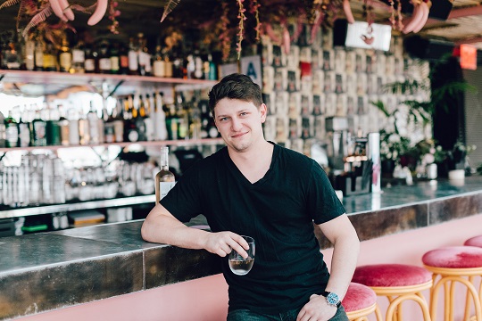 Jesse Bongiovi, posing by the bar