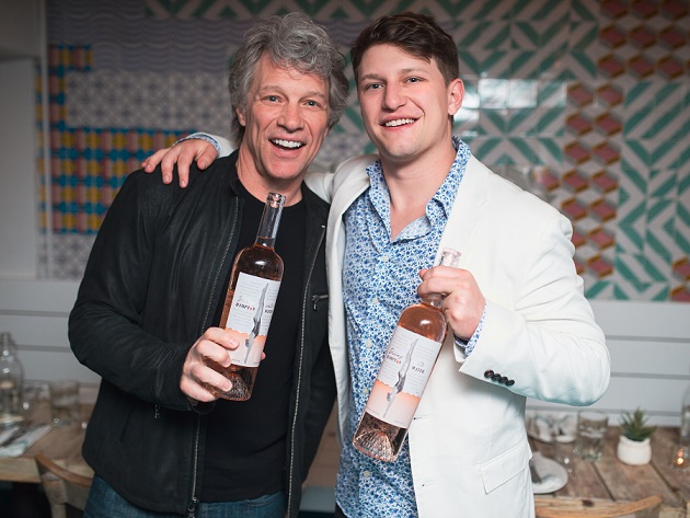 Jon Bon Jovi and his son, Jess Bongiovi, with bottles of their wine