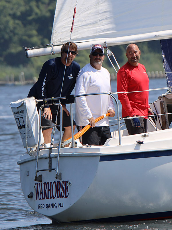 Three men on a boat